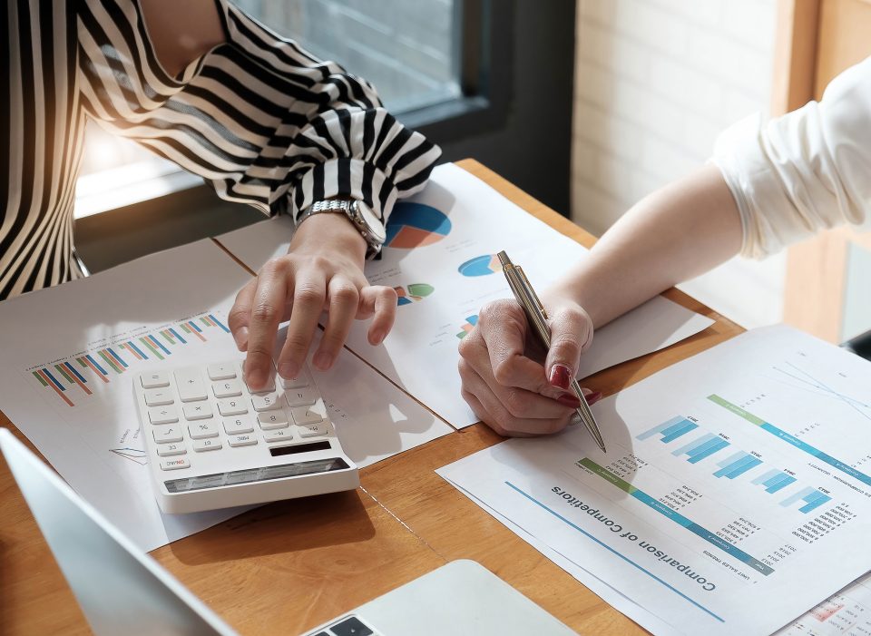 financial advisory services. Group of business advisor showing plan of investment to clients in the consultancy office.
